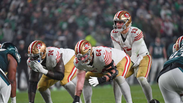 Dec 3, 2023; Philadelphia, Pennsylvania, USA; San Francisco 49ers center Jake Brendel (64) snaps the ball to quarterback Brock Purdy (13) against the Philadelphia Eagles at Lincoln Financial Field. Mandatory Credit: Eric Hartline-USA TODAY Sports  